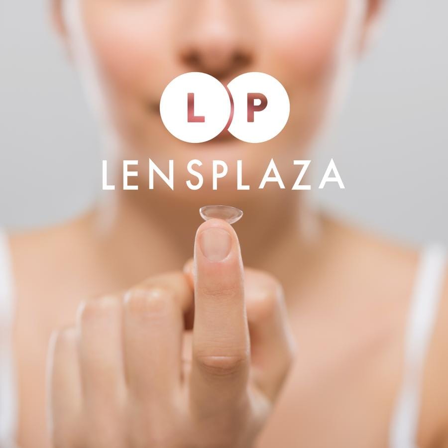 Person holding a contact lense on their fingertip