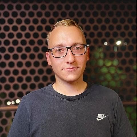 A portrait photo of Adam