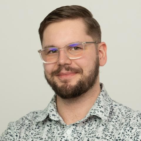A portrait photo of Jonasz