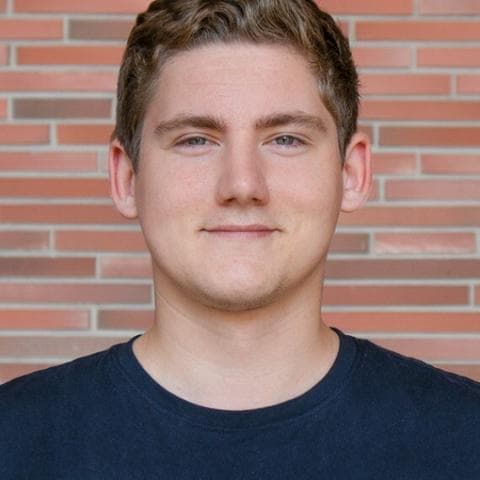 A portrait photo of Michał