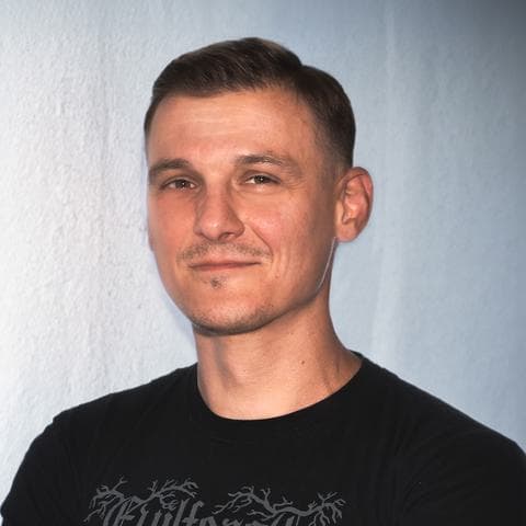 A portrait photo of Piotr