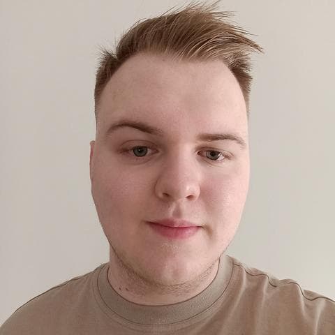 A portrait photo of Szymon